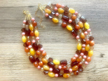 Load image into Gallery viewer, Auckland in Fall chunky necklace, Wanderlust Collection beaded jewelry, resin beaded Ombré necklace pink red yellow orange brown