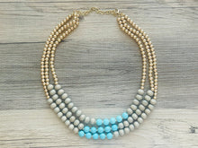 Load image into Gallery viewer, Blue turquoise statement necklace, chunky bib beaded jewelry light blue necklace, multi strand wood &amp; gold, Traveler Collection