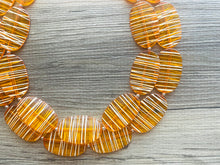 Load image into Gallery viewer, Textured Orange Statement Necklace, Big Beaded necklace, chunky beaded necklace wedding, clementine jewelry, white striped jewelry