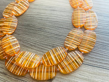 Load image into Gallery viewer, Textured Orange Statement Necklace, Big Beaded necklace, chunky beaded necklace wedding, clementine jewelry, white striped jewelry