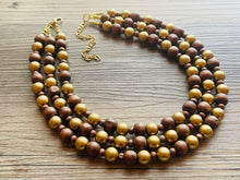 Load image into Gallery viewer, Gold &amp; Brown statement necklace, chunky bib beaded jewelry 3 strand neutral necklace, wood multi strand wood, Traveler Collection