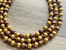 Load image into Gallery viewer, Gold &amp; Brown statement necklace, chunky bib beaded jewelry 3 strand neutral necklace, wood multi strand wood, Traveler Collection