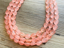 Load image into Gallery viewer, Peach Chunky Statement Necklace &amp; Stretch Bracelet set, Triple Strand Beaded Jewelry, light coral pink jewelry, bridesmaid jelly bean