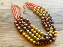 Load image into Gallery viewer, Coral Gold &amp; Brown statement necklace, asymmetric chunky bib beaded jewelry 4 strand neutral, wood multi strand wood thick bib vintage