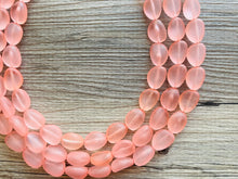 Load image into Gallery viewer, Peach Chunky Statement Necklace &amp; Stretch Bracelet set, Triple Strand Beaded Jewelry, light coral pink jewelry, bridesmaid jelly bean