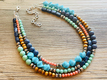 Load image into Gallery viewer, Tributaries Statement Necklace, chunky bib beaded jewelry, Summer blue coral green necklace, beaded glass jewelry wood chambray silver