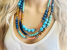 Load image into Gallery viewer, Tributaries Statement Necklace, chunky bib beaded jewelry, Summer blue coral green necklace, beaded glass jewelry wood chambray silver