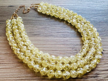 Load image into Gallery viewer, Speckled Pale Yellow Statement jewelry set, Chunky Beaded Necklace, yellow Jewelry, bright colorful Necklace yellow beaded earrings gold