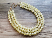 Load image into Gallery viewer, Speckled Pale Yellow Statement jewelry set, Chunky Beaded Necklace, yellow Jewelry, bright colorful Necklace yellow beaded earrings gold