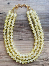 Load image into Gallery viewer, Speckled Pale Yellow Statement jewelry set, Chunky Beaded Necklace, yellow Jewelry, bright colorful Necklace yellow beaded earrings gold