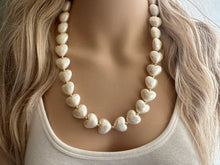 Load image into Gallery viewer, Paper Mache Heart Statement Necklace, Chunky single Strand Jewelry, Valentines Day jewelry, chunky cream bib beaded colorful off white gold