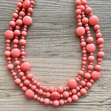 Load image into Gallery viewer, Chunky Multi Strand coral Statement Necklace, pink orange beaded jewelry, peach necklace, coral jewelry, peach bridesmaid, dressy graduated